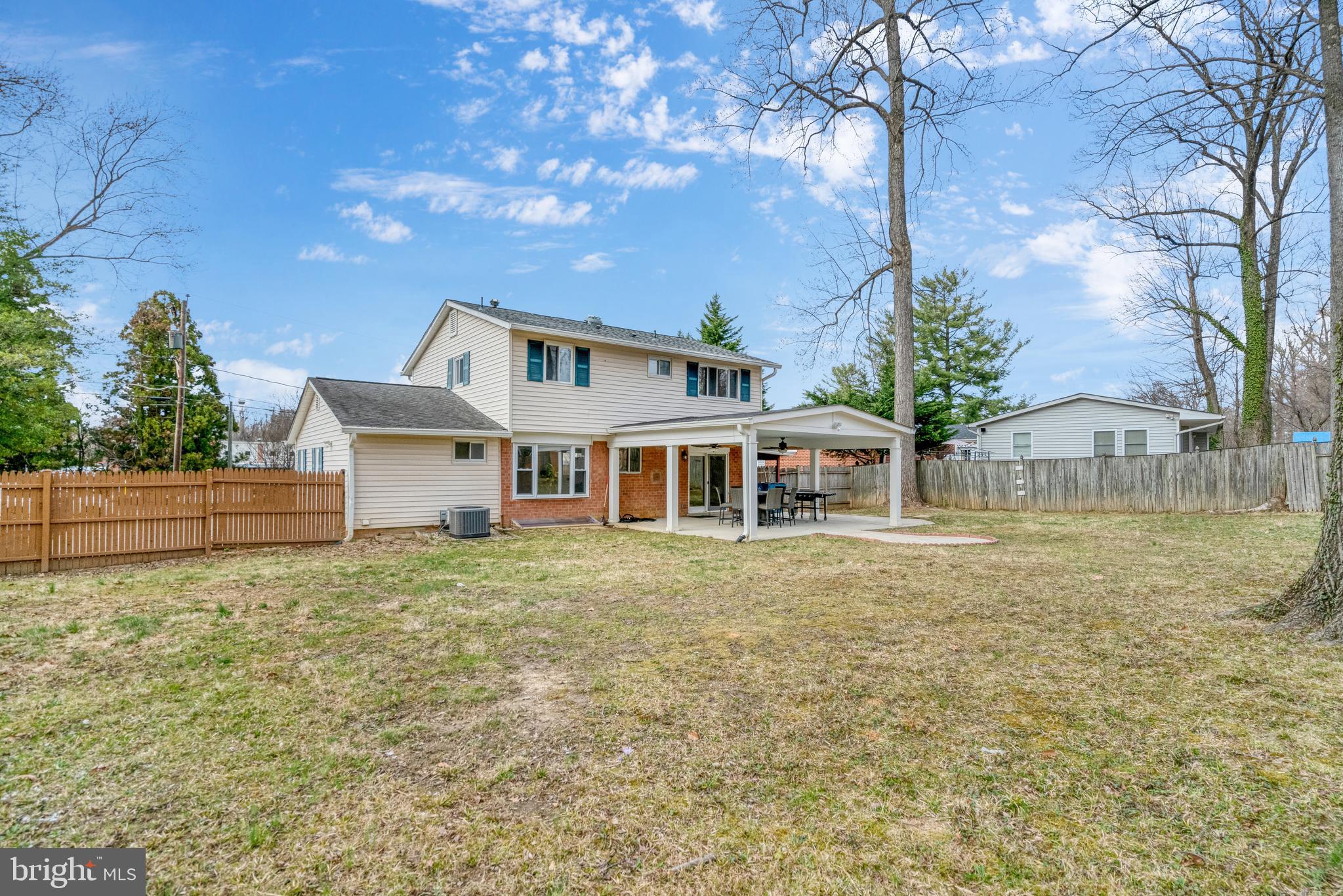 8941 Burke Lake Road Springfield, VA 22151 - Photo 33 of 34 a front view of house with yard and trees in the background