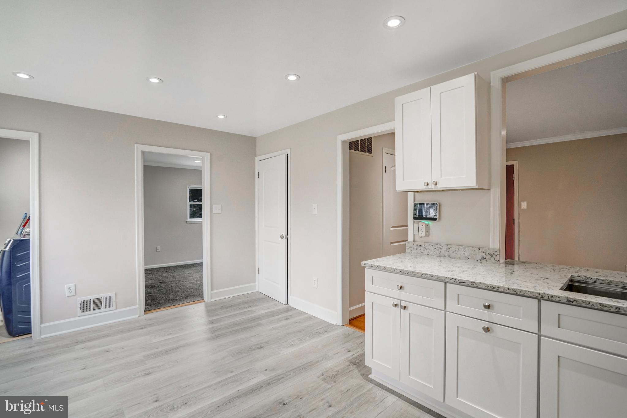 8941 Burke Lake Road Springfield, VA 22151 - Photo 10 of 34 a view of a kitchen with wooden floor
