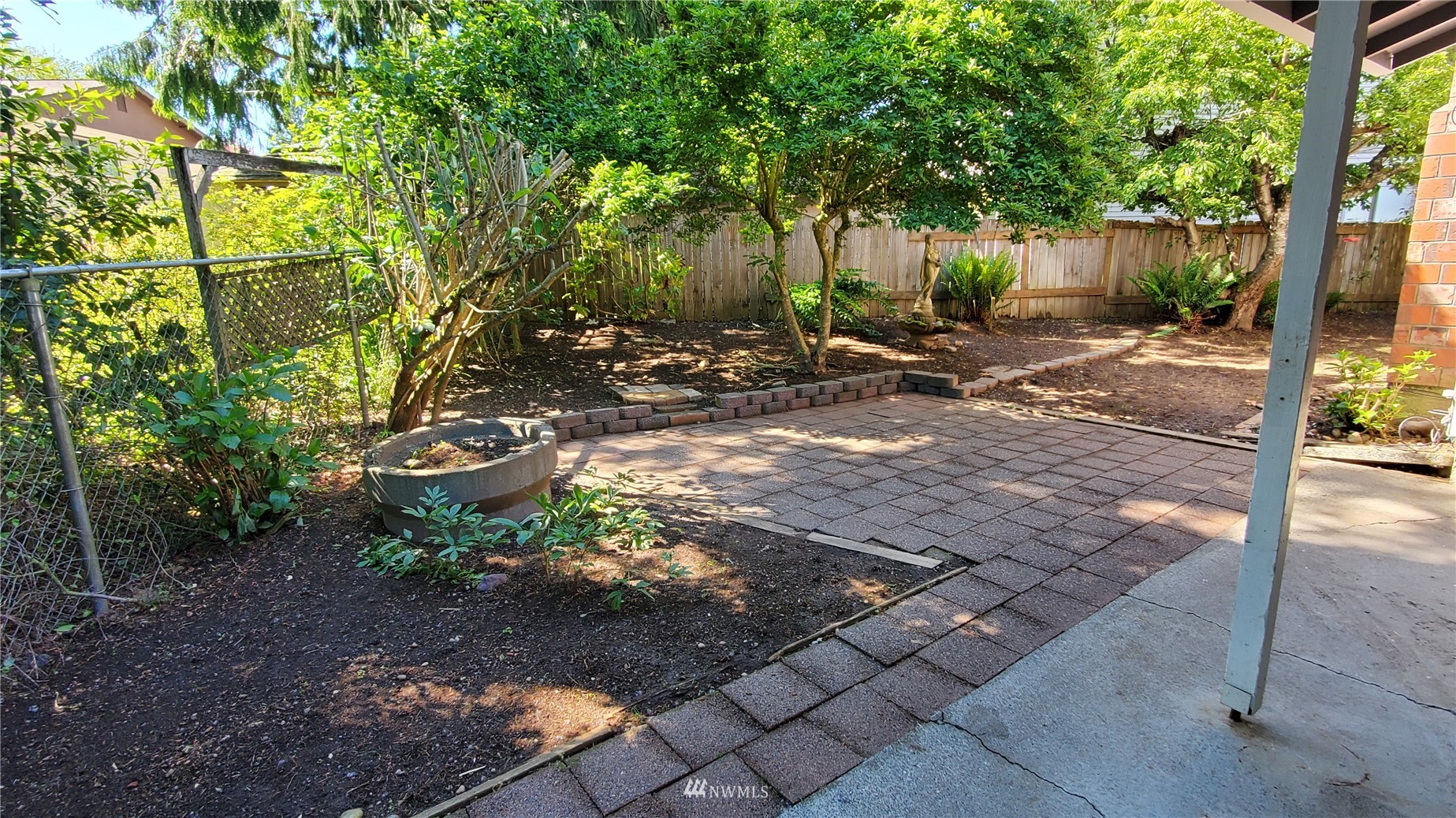21603 9th Place West Bothell, WA 98021 - Photo 13 of 28 a view of a backyard with trees