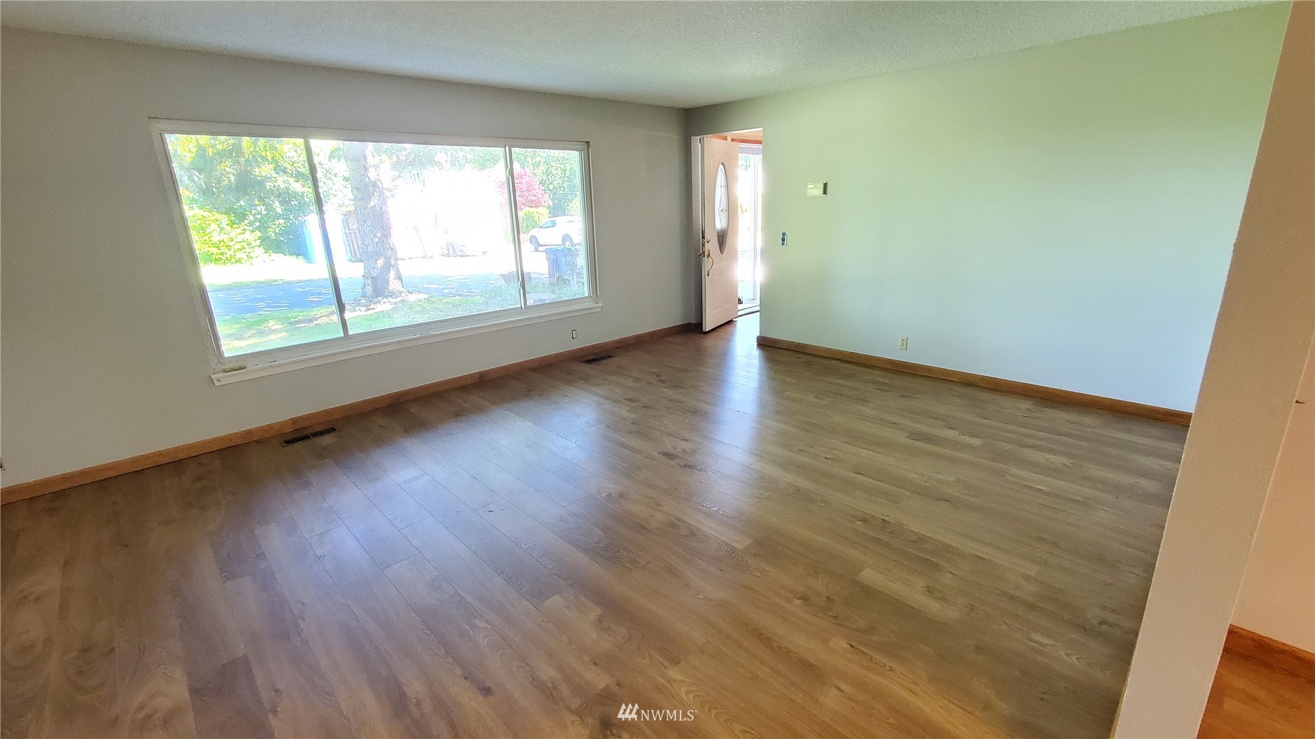21603 9th Place West Bothell, WA 98021 - Photo 5 of 28 an empty room with wooden floor and windows