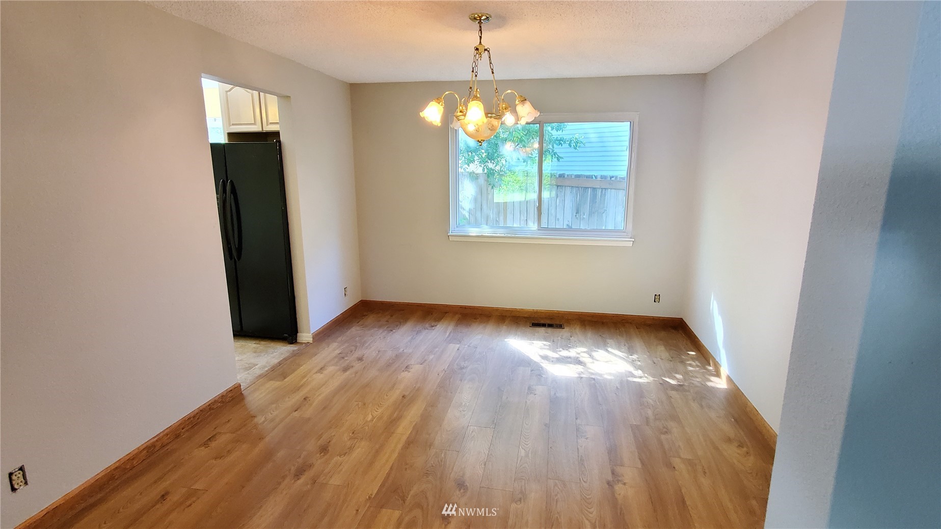 21603 9th Place West Bothell, WA 98021 - Photo 7 of 28 an empty room with wooden floor and windows