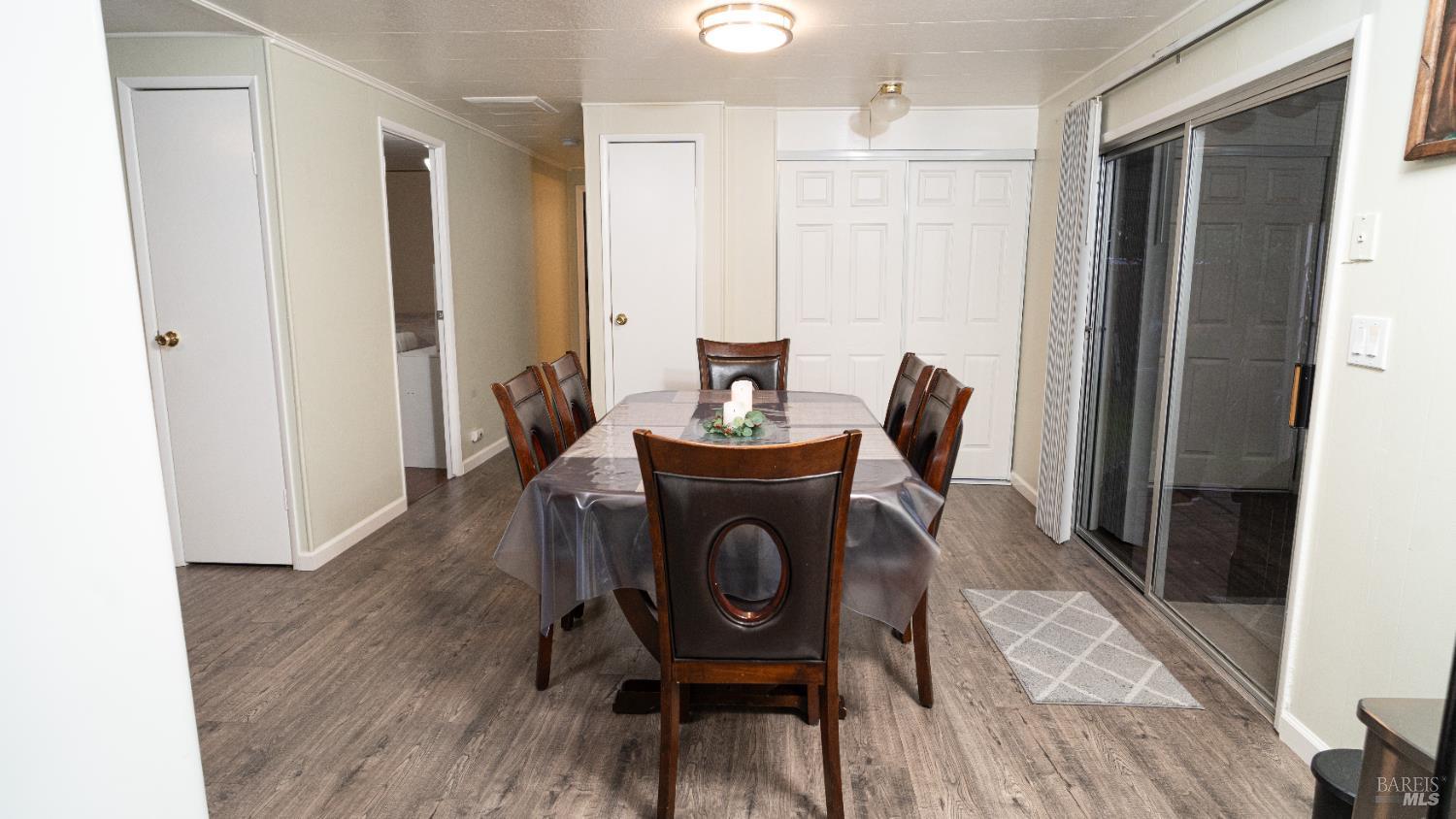 401 Frisbie Avenue Santa Rosa, CA 95407 - Photo 15 of 50 a view of a dining room with furniture and wooden floor