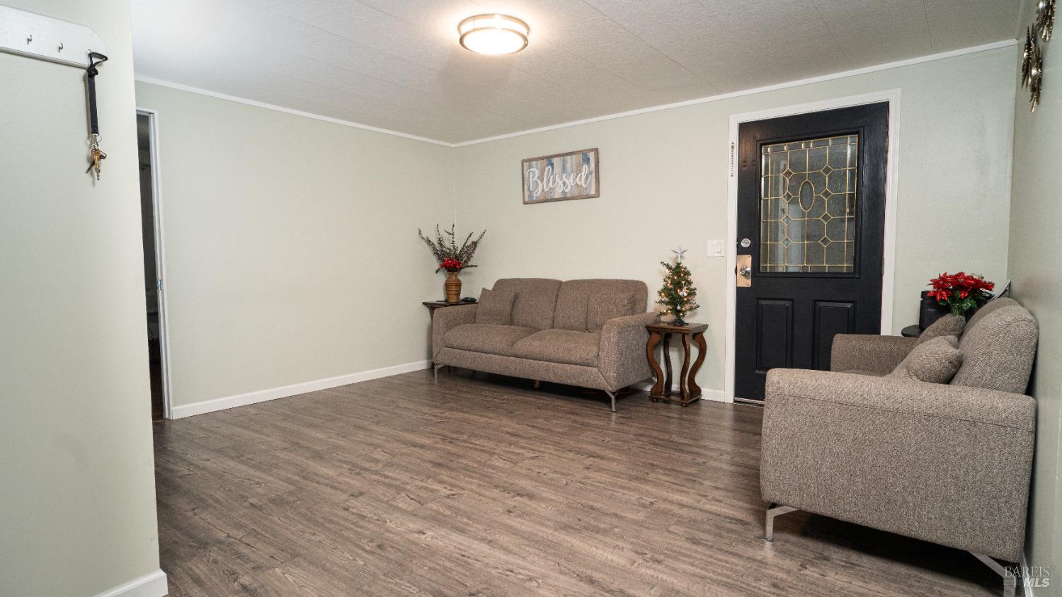 401 Frisbie Avenue Santa Rosa, CA 95407 - Photo 17 of 50 a living room with furniture and a wooden floor