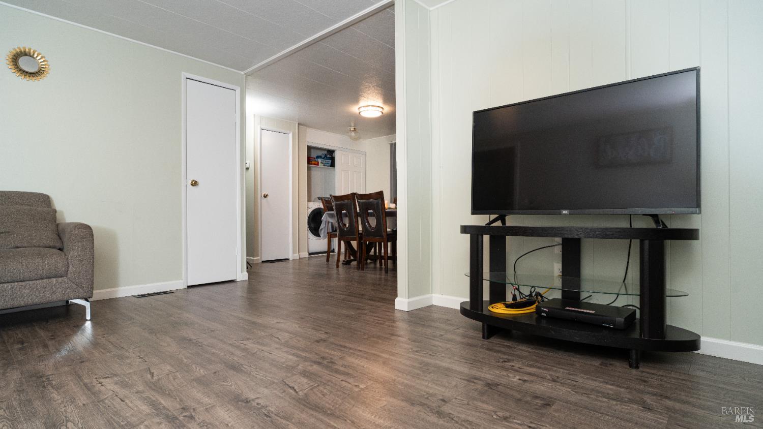 401 Frisbie Avenue Santa Rosa, CA 95407 - Photo 20 of 50 a view of livingroom with furniture and wooden floor