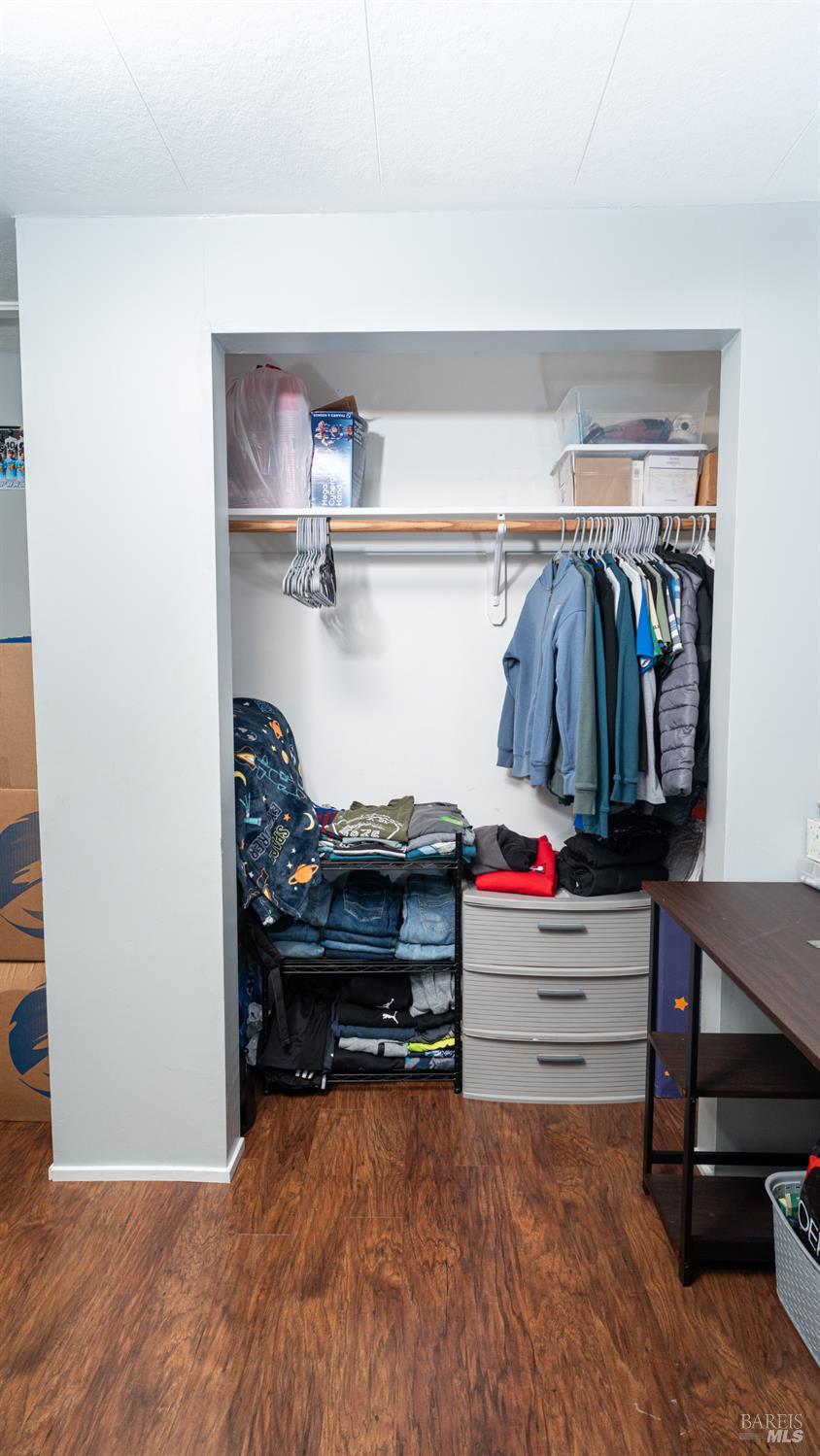 401 Frisbie Avenue Santa Rosa, CA 95407 - Photo 22 of 50 a view of walk in closet with clothes and shoes