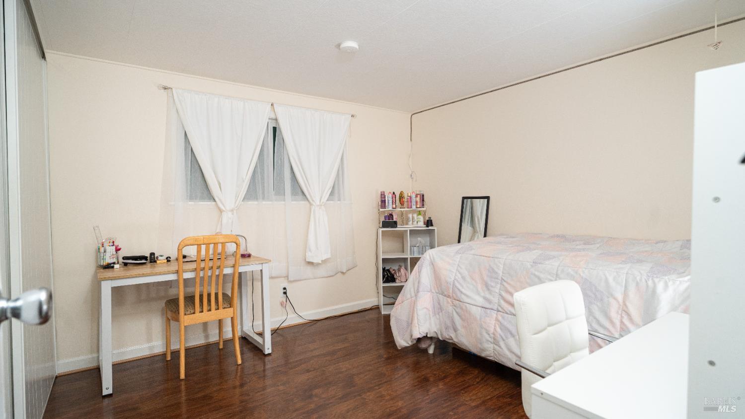 401 Frisbie Avenue Santa Rosa, CA 95407 - Photo 23 of 50 a bed room with a bed and a chair