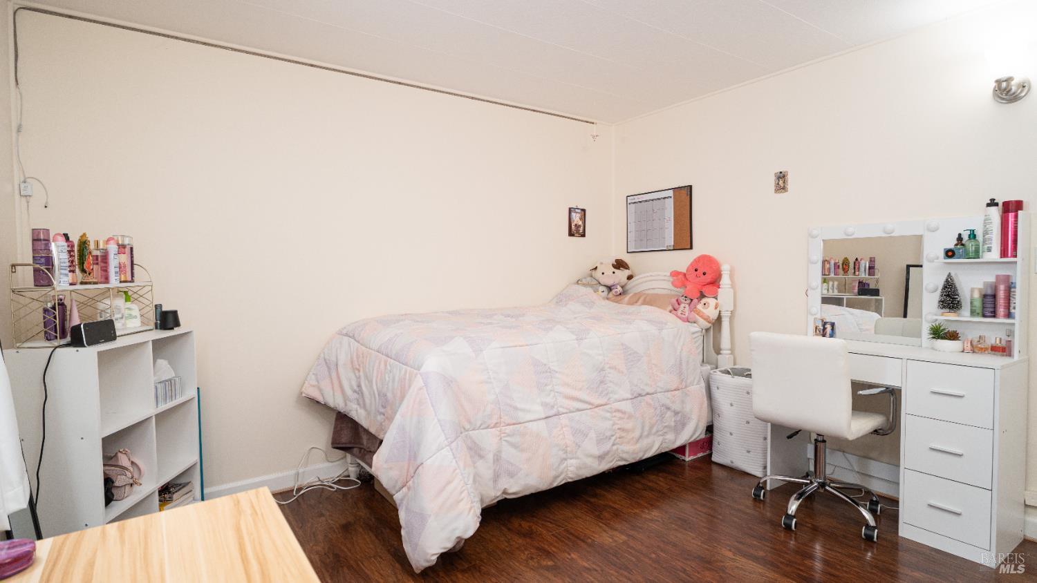 401 Frisbie Avenue Santa Rosa, CA 95407 - Photo 24 of 50 a bedroom with a bed and a desk in it