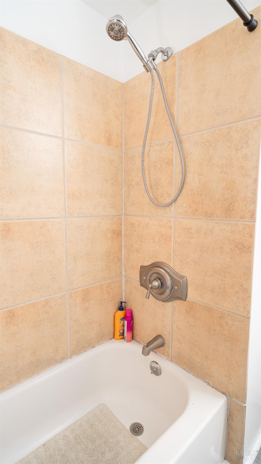 401 Frisbie Avenue Santa Rosa, CA 95407 - Photo 30 of 50 a bathroom with a sink and a shower