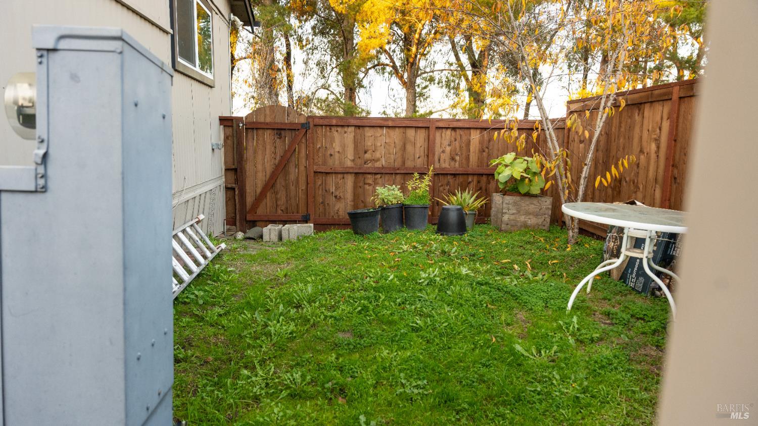 401 Frisbie Avenue Santa Rosa, CA 95407 - Photo 46 of 50 a view of a backyard with wooden fence