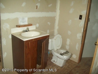1 Rr Factoryville, PA 18419 - Photo 5 of 10 a bathroom with a granite countertop sink a toilet and a mirror
