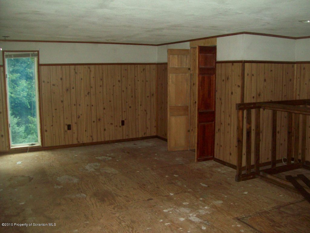 1 Rr Factoryville, PA 18419 - Photo 10 of 10 an empty room with wooden floor and windows