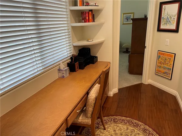 a room with furniture and a wooden floor