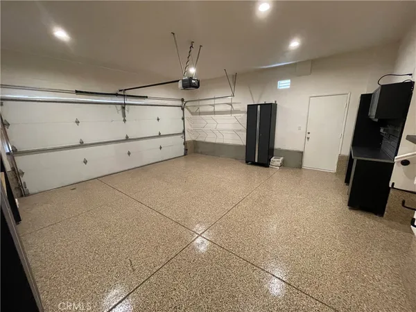 a kitchen with refrigerator and window