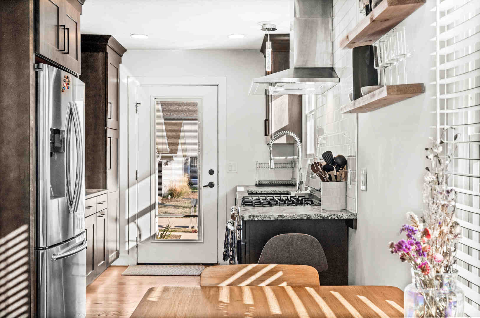 1402 River Landing Street Normal, IL 61761 - Photo 15 of 36 a kitchen with stainless steel appliances granite countertop a refrigerator and a stove