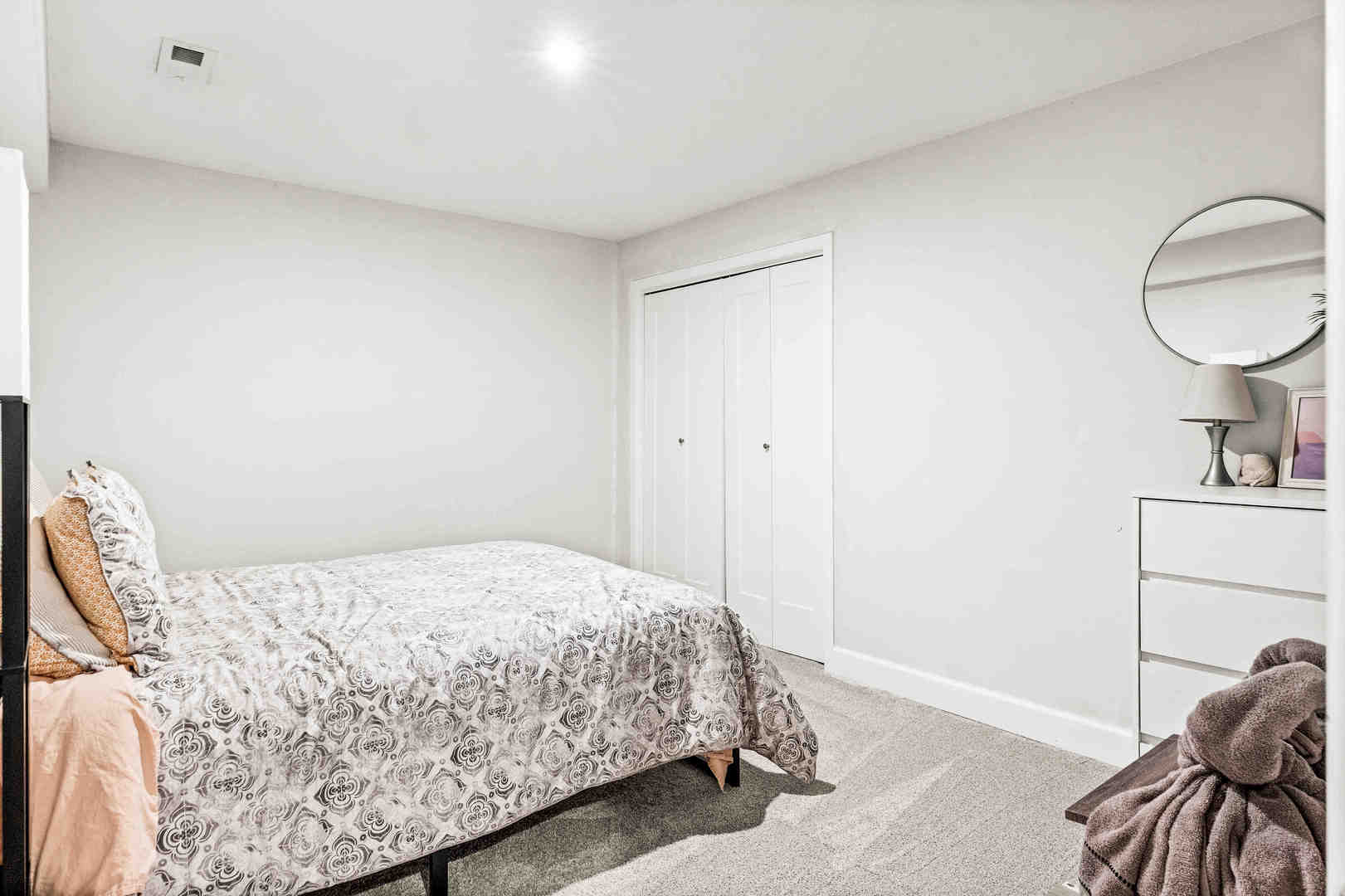 1402 River Landing Street Normal, IL 61761 - Photo 26 of 36 a bedroom with a bed and a mirror