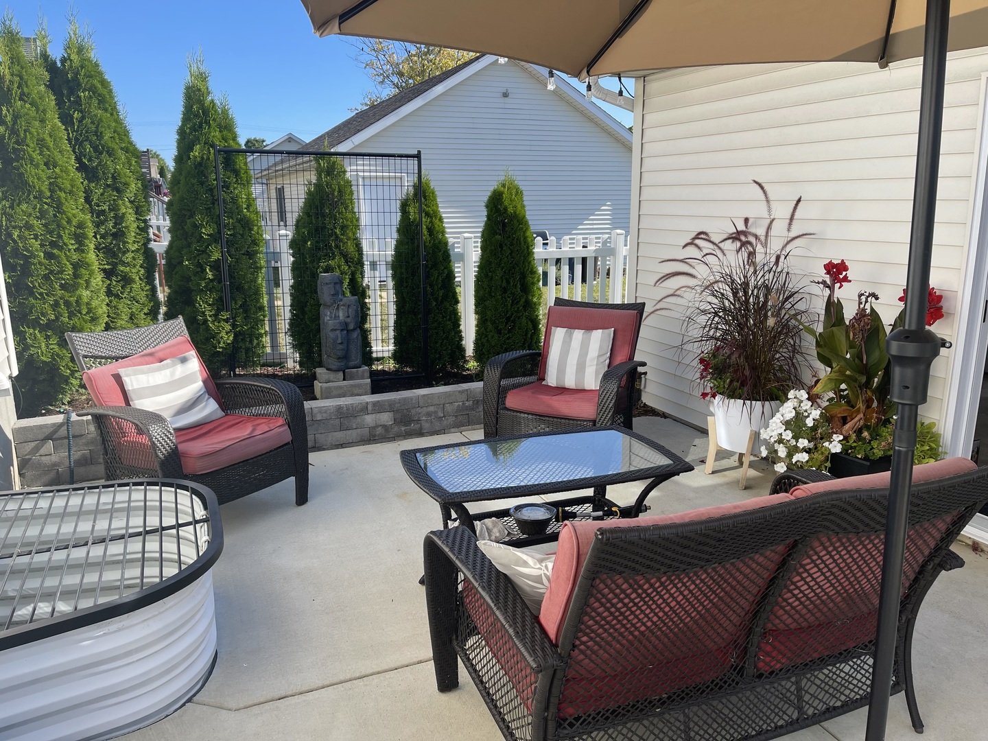 1402 River Landing Street Normal, IL 61761 - Photo 34 of 36 a outdoor living space with furniture and a potted plant