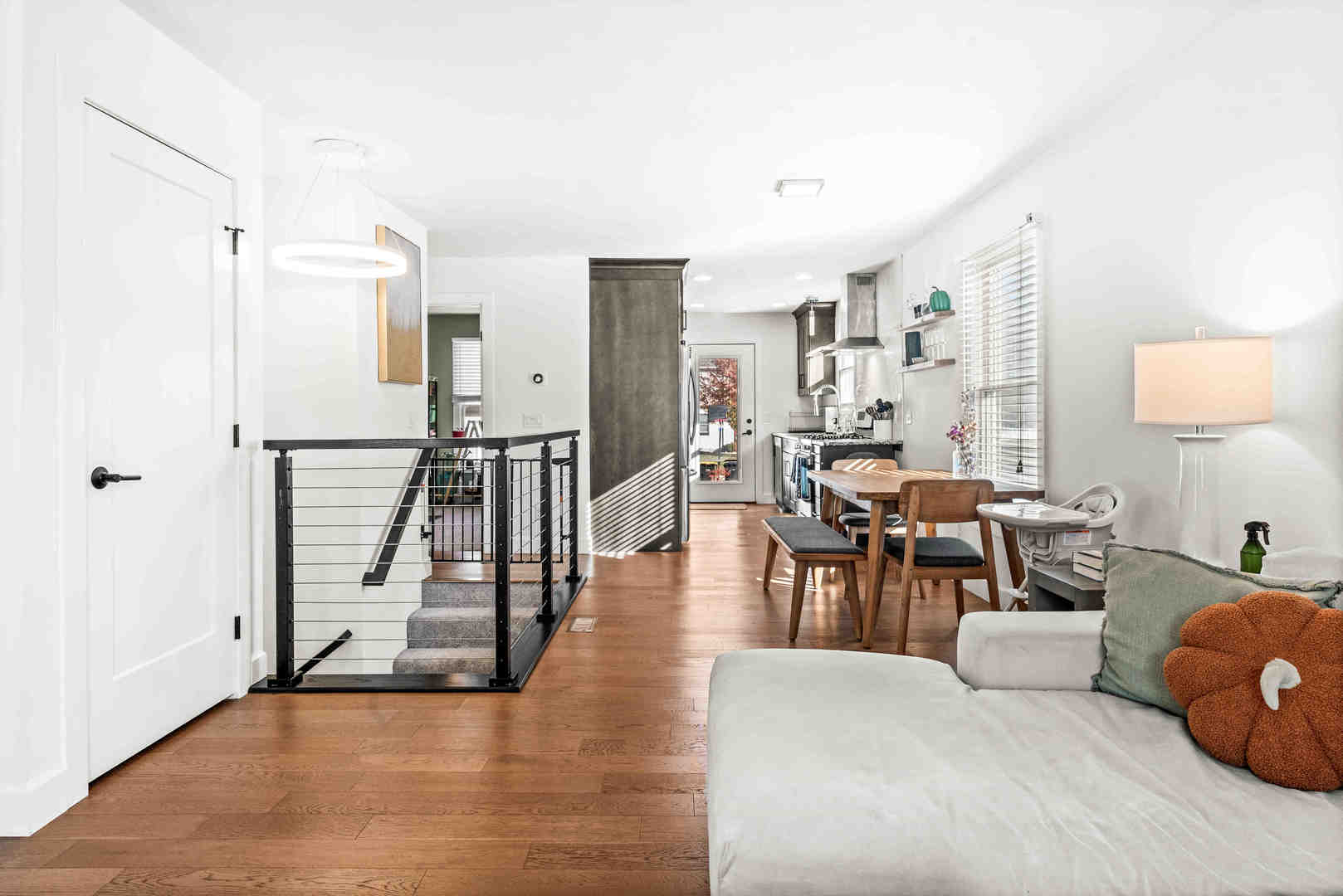1402 River Landing Street Normal, IL 61761 - Photo 10 of 36 a living room with furniture and a wooden floor