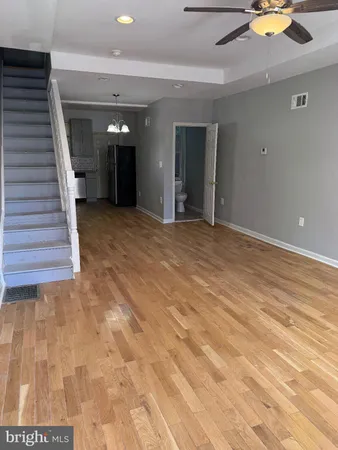 a front view of a house with large windows