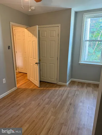a room with bed and window