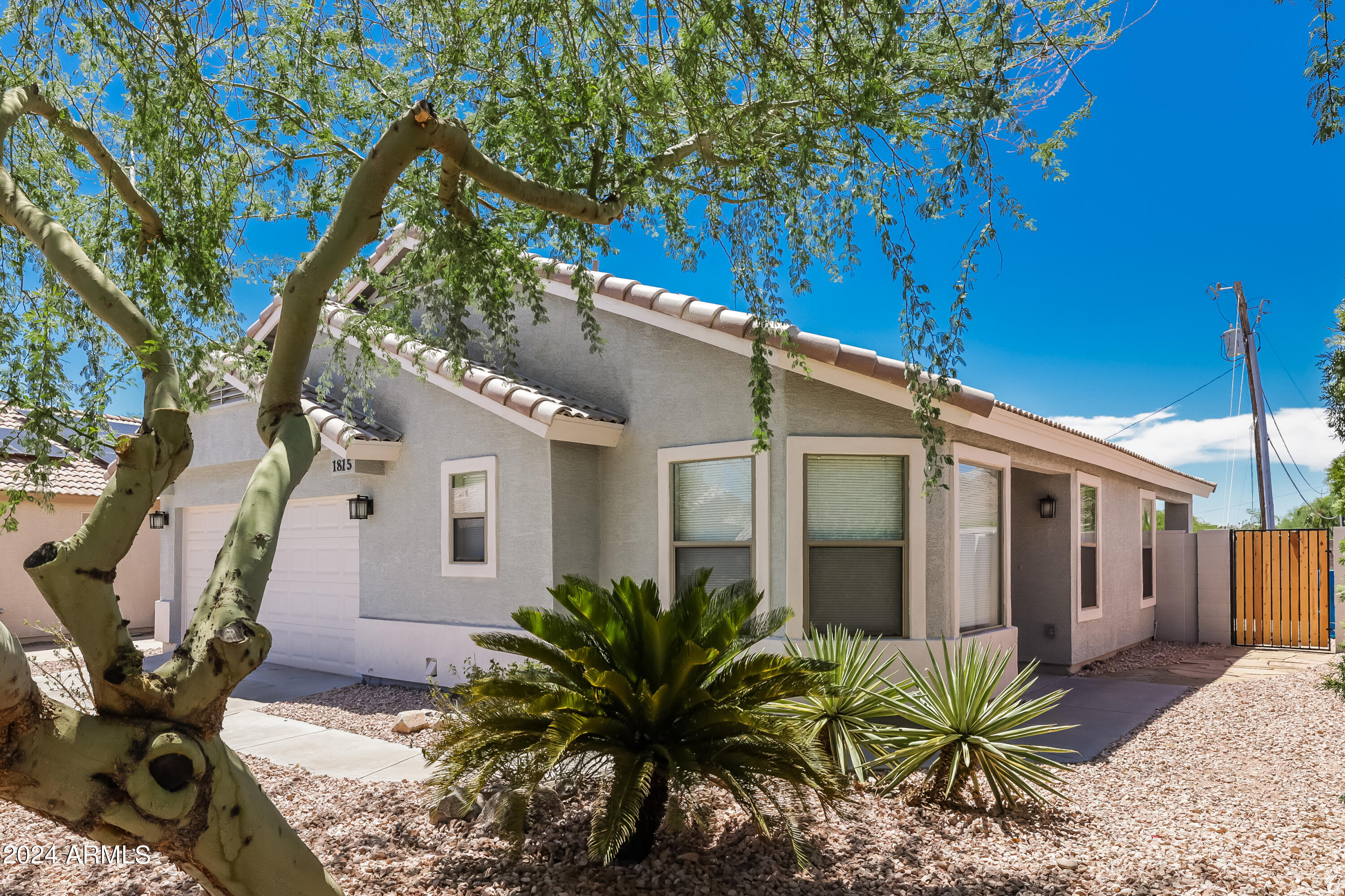 a view of a house with a tree