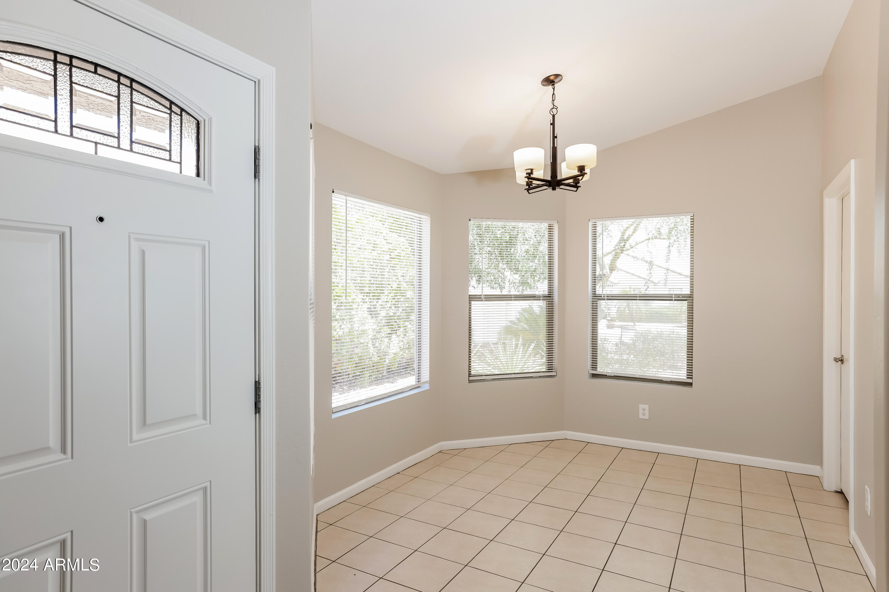 1815 East Hamel Way Phoenix, AZ 85022 - Photo 5 of 16 an empty room with windows and entrance