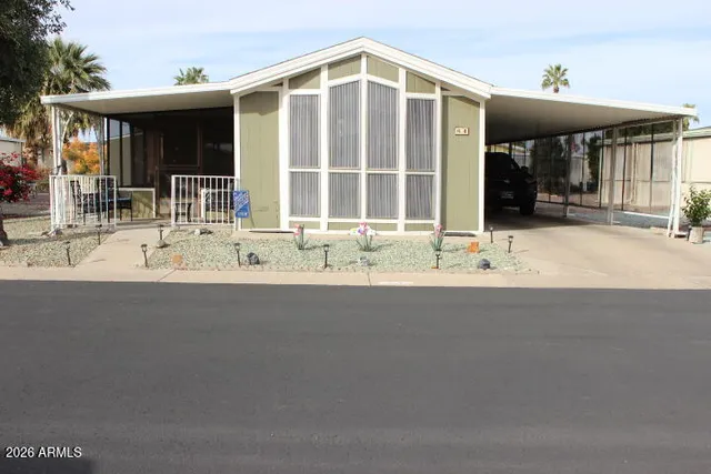 a view of a house with a patio and a dining space