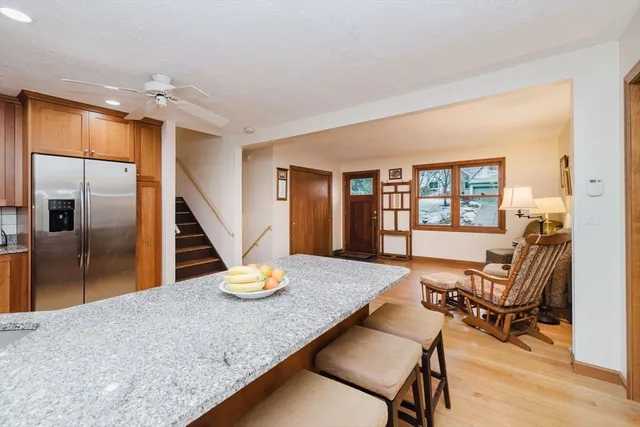 a dining room with a wooden table and chairs