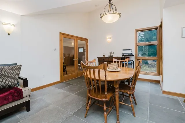 a bedroom with furniture and a wooden floor