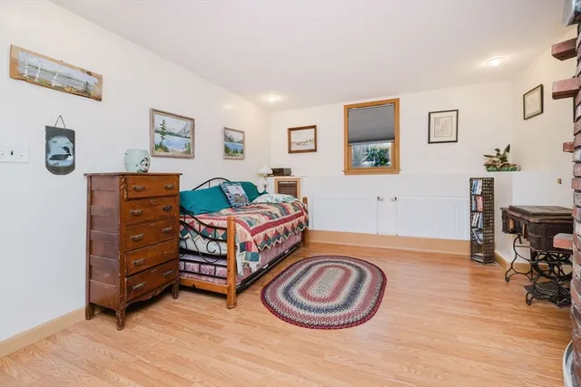 a bathroom with a toilet and a shower curtain