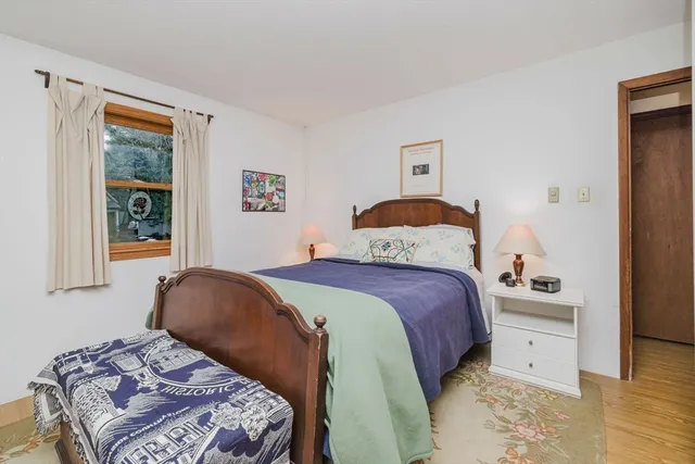 a backyard of a house with barbeque oven table and chairs