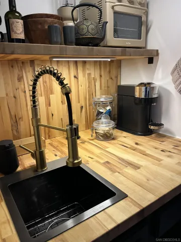 a bedroom with a bed window and couch