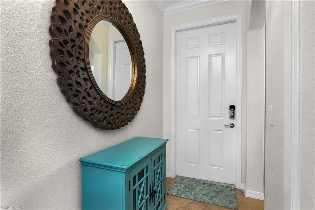 9719 Acqua Court, Unit 214 Naples, FL 34113 - Photo 23 of 50 a bathroom with a sink and a mirror