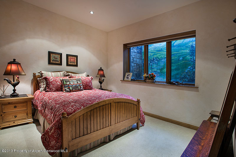 572 Diamond A Ranch Road Carbondale, CO 81623 - Photo 23 of 27 a bedroom with a bed and a large window
