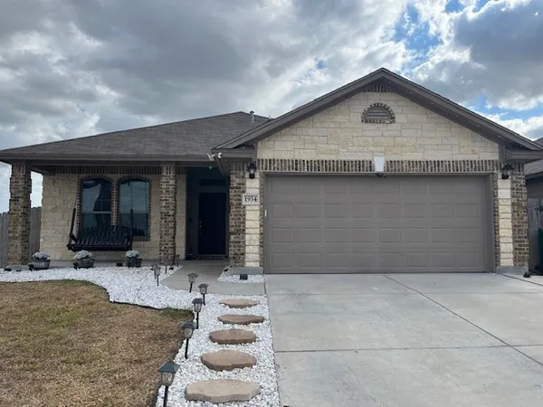 a front view of a house with yard