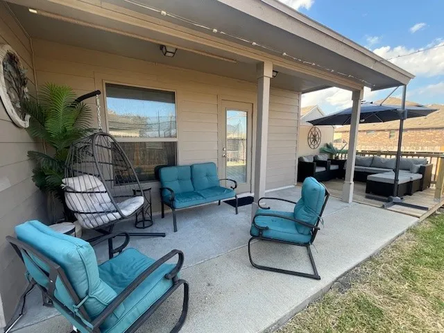 a dining room with furniture and window