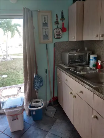 a kitchen with a sink and a stove