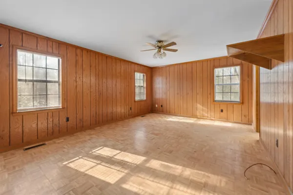 an empty room with closet area