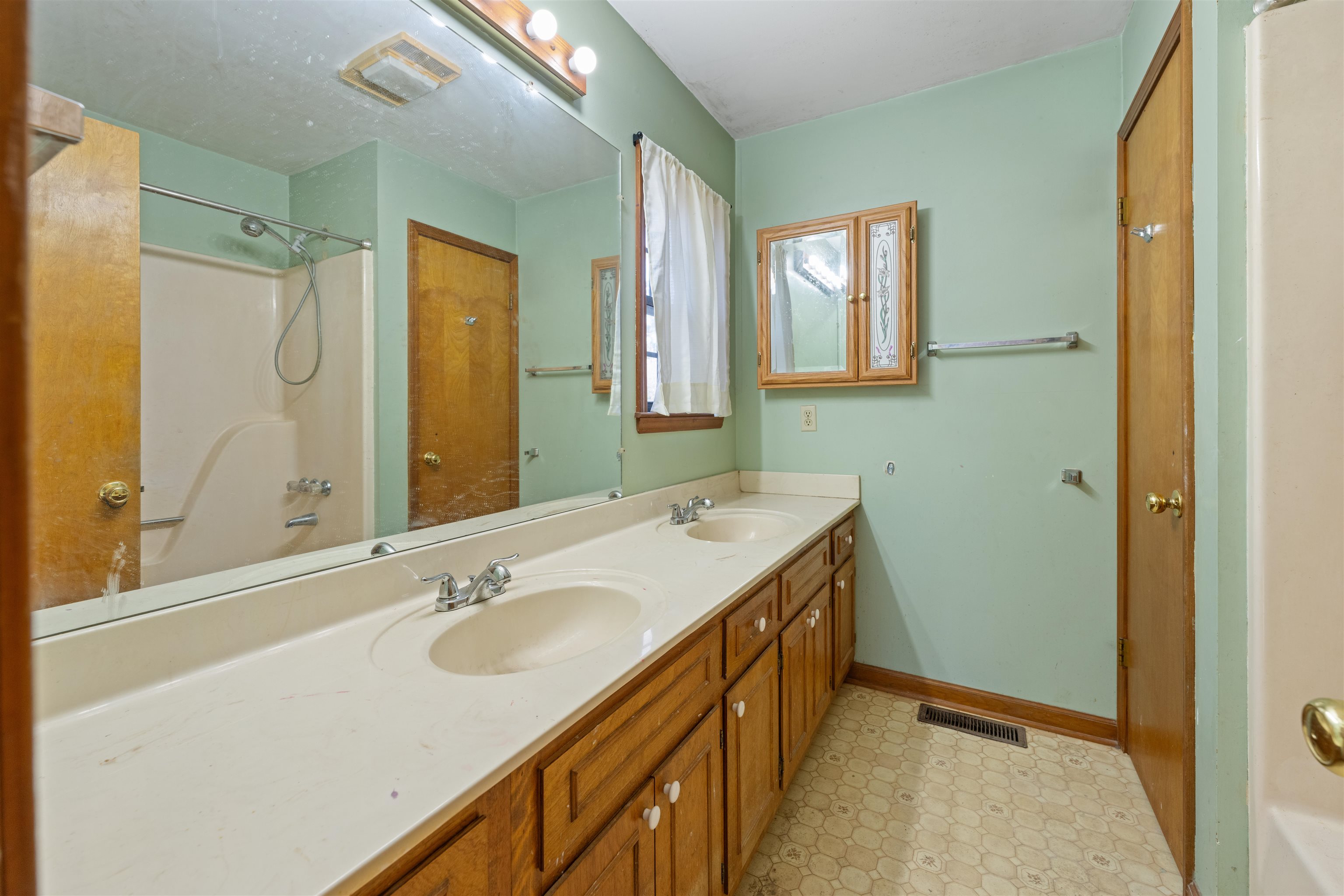 465 Metro Road Eads, TN 38028 - Photo 18 of 27 a bathroom with a granite countertop sink mirror and a bathtub