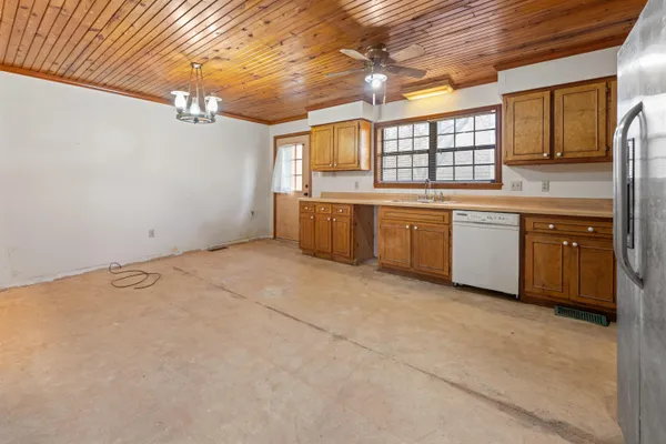 a large kitchen with a large window