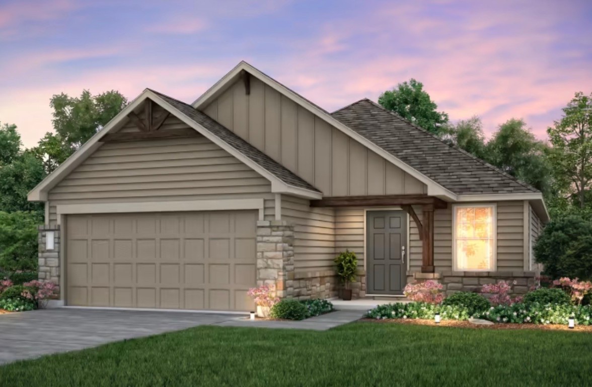 a front view of house with a garden