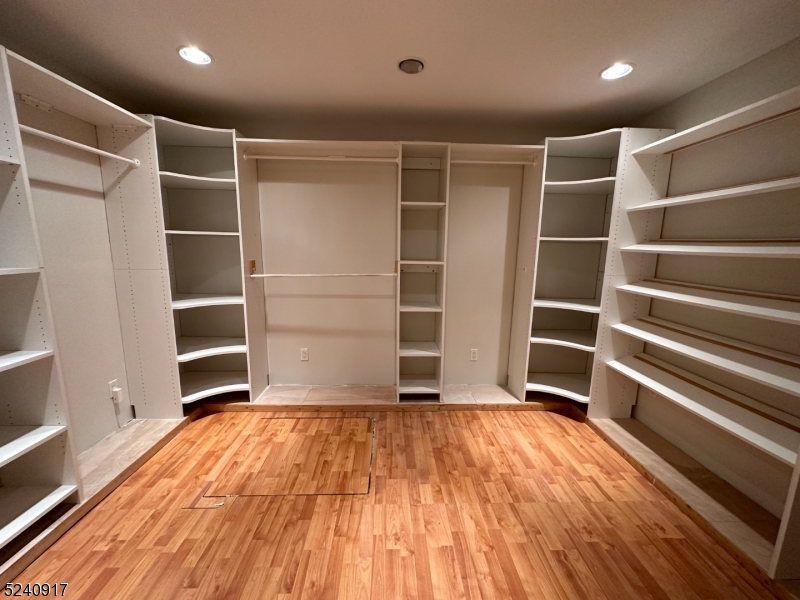 213 Sand Shore Road Budd Lake, NJ 07828 - Photo 13 of 26 a view of an empty room with wooden floor and a window