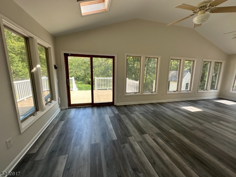213 Sand Shore Road Budd Lake, NJ 07828 - Photo 15 of 26 a view of an empty room with wooden floor and a window