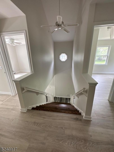 213 Sand Shore Road Budd Lake, NJ 07828 - Photo 17 of 26 a view of a hallway with wooden floor and staircase