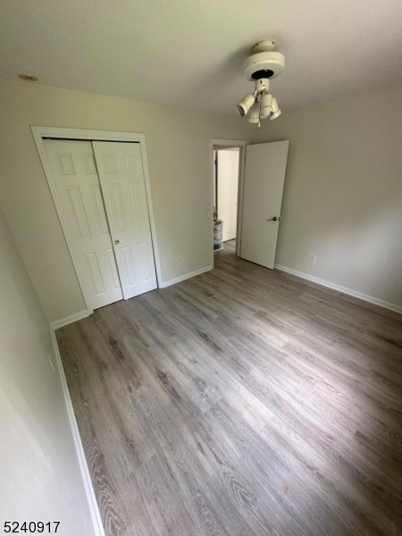 213 Sand Shore Road Budd Lake, NJ 07828 - Photo 18 of 26 a view of empty room with window