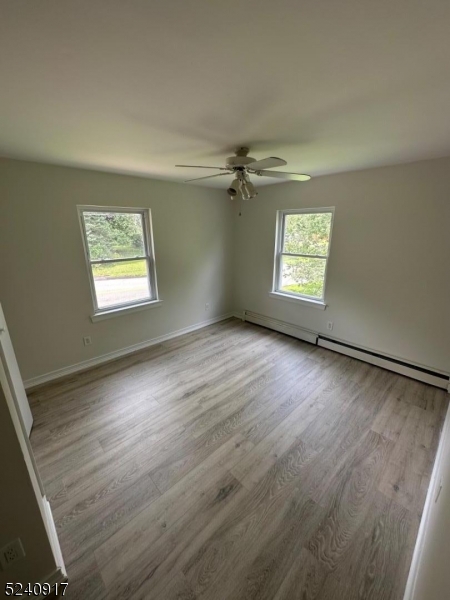 213 Sand Shore Road Budd Lake, NJ 07828 - Photo 19 of 26 wooden floor in an empty room with a window