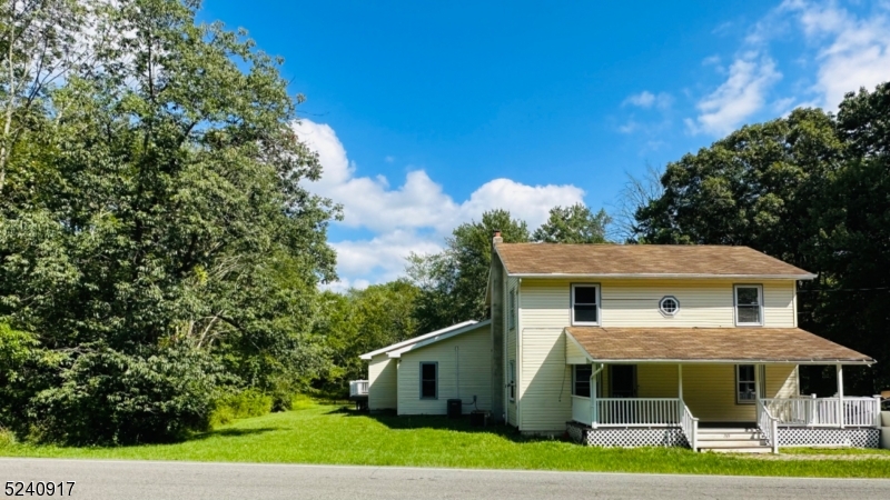 213 Sand Shore Road Budd Lake, NJ 07828 - Photo 2 of 26 a front view of a house with a yard
