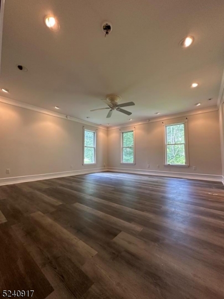 213 Sand Shore Road Budd Lake, NJ 07828 - Photo 22 of 26 an empty room with wooden floor and windows