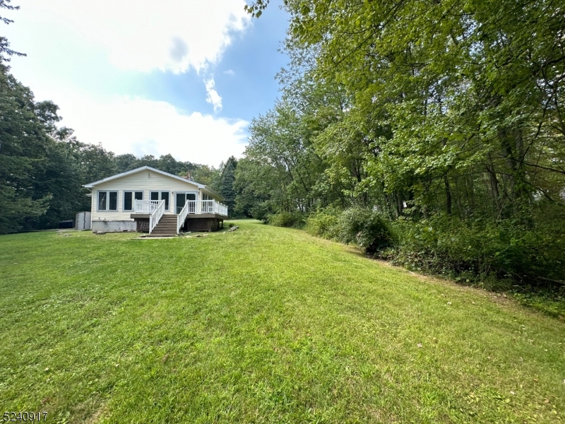 213 Sand Shore Road Budd Lake, NJ 07828 - Photo 26 of 26 a view of house with garden and deck