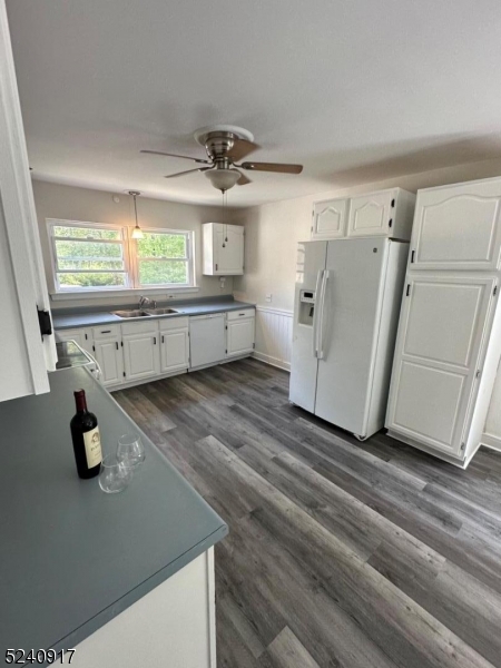 213 Sand Shore Road Budd Lake, NJ 07828 - Photo 5 of 26 a kitchen with a refrigerator and a sink