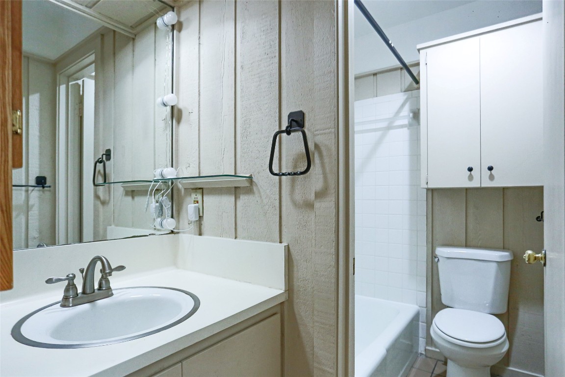 1003 Beaver Trail, Unit A Austin, TX 78746 - Photo 11 of 15 a bathroom with a sink toilet and shower